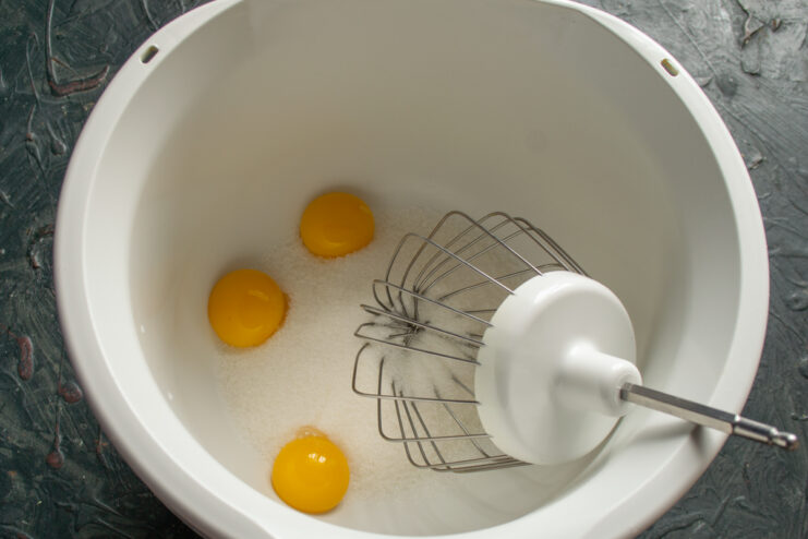 Prep Egg Yolks And Sugar Egg yolks and granulated sugar in a mixing bowl