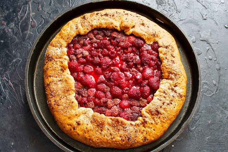 Baked golden berry galette. Freshly baked golden brown berry galette on a baking sheet