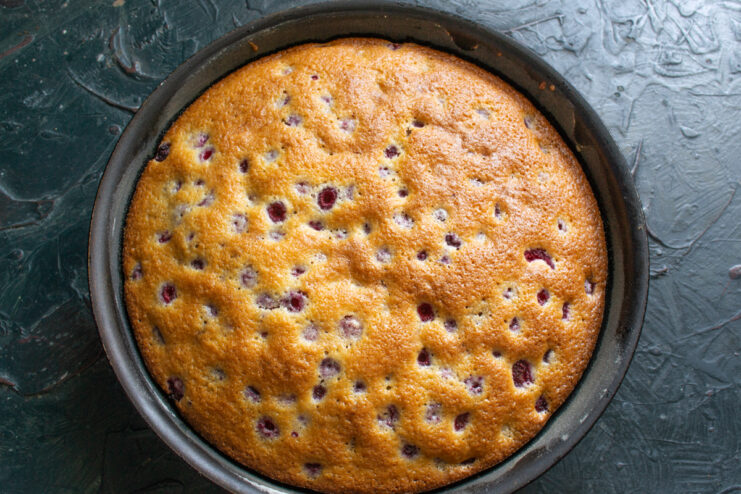 Freshly Baked Cake Golden brown baked raspberry semolina cake resting in its pan