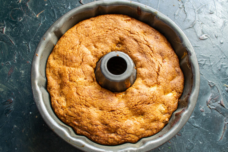 Baked cake fresh from the oven Golden baked cake resting inside the tube pan