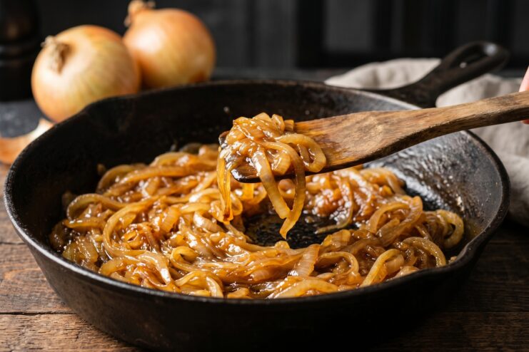 Perfectly Caramelized Onions Golden caramelized onions in a cast iron skillet