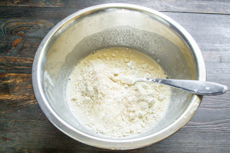 Adding wheat flour to the starter and water mixture