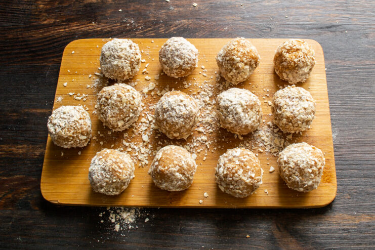 Final chilling process Coated truffles resting on a wooden cutting board before chilling