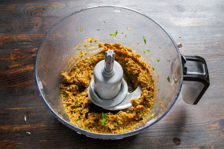Finished peanut paste base Thick seasoned peanut paste gathered in a blender