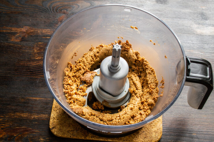 Thick and clumpy chocolate peanut mixture during the initial blending stage.