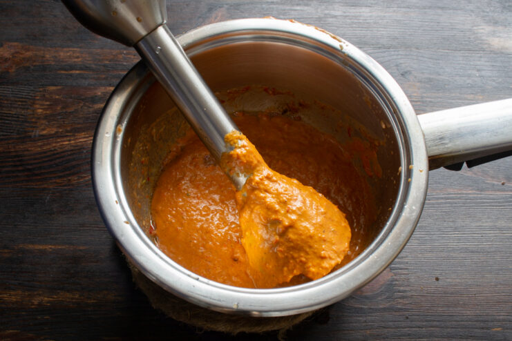 Blending the sauce mixture Blending the chili sauce ingredients into a smooth cream with an immersion blender