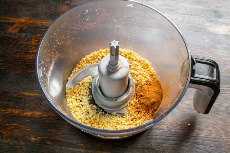 Preparing the coating Crushed almonds and cocoa powder in a blender bowl