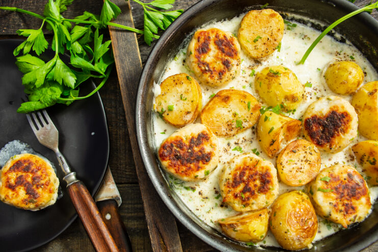 Finished dish of new potatoes with chicken meatballs in a creamy sauce