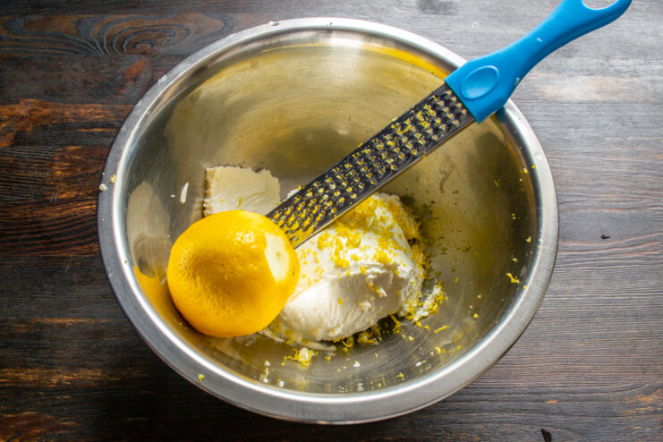 Adding freshly grated lemon zest and juice to the farmer's cheese