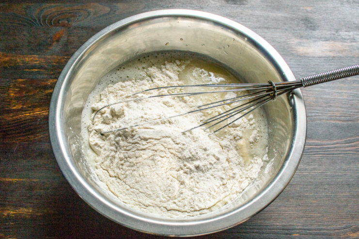 Adding Flour And Baking Soda All-purpose flour added to the liquid crepe batter mixture