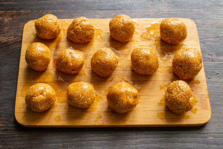Shaped peanut truffles Round peanut truffle balls arranged on a wooden board