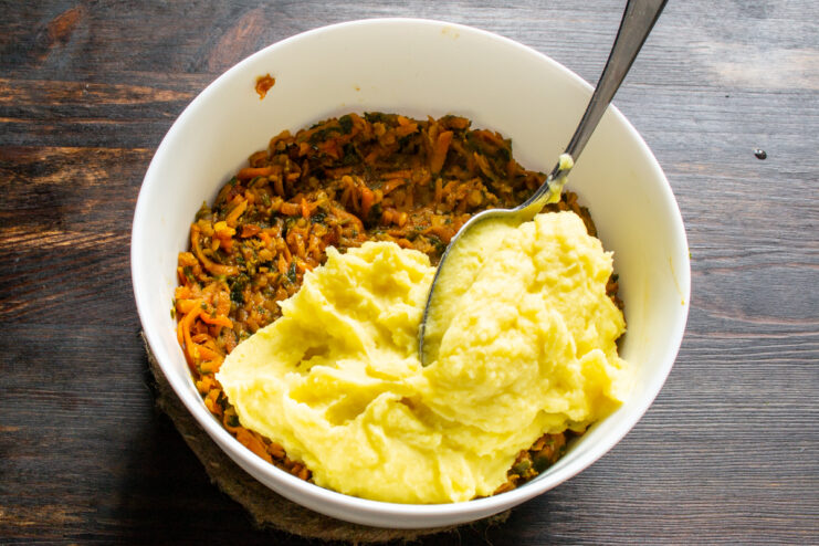 Potato Layer Layering mashed potatoes over the lentil filling
