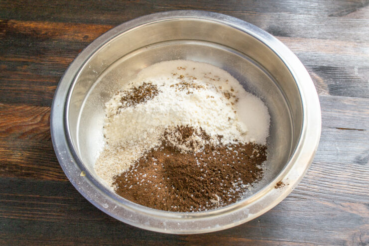 Mixed wheat and rye flours with malt, salt, and sugar in a bowl