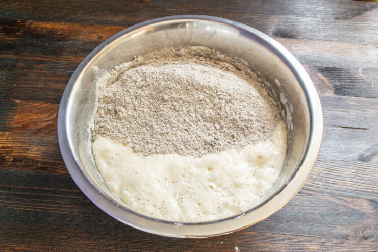 Combining the dry flour mixture with the bubbly levain