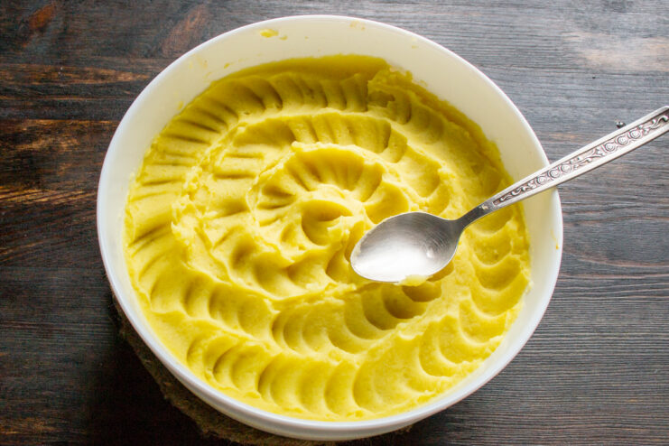 Decorating the Top Creating wavy patterns on the mashed potatoes with a spoon