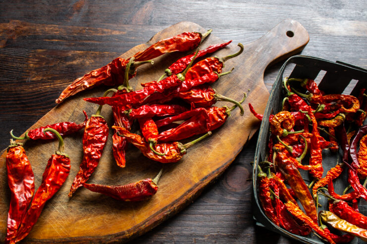 Preparing the dried chilies High-quality dried chili peppers being prepared for the sauce