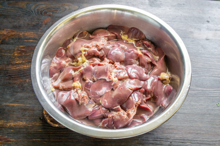 Prepping Chicken Liver Fresh chicken liver in a metal bowl ready for grinding.