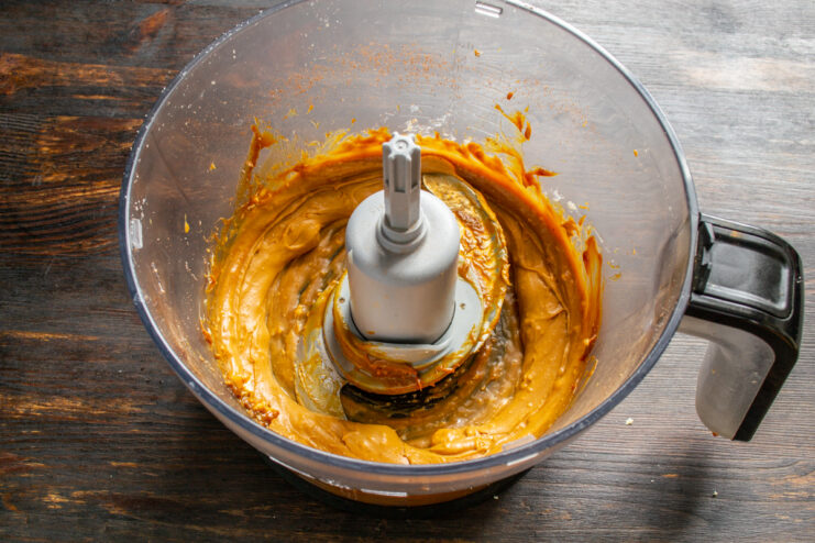 Creamy butter and honey base Whipped butter and honey in a mixing bowl